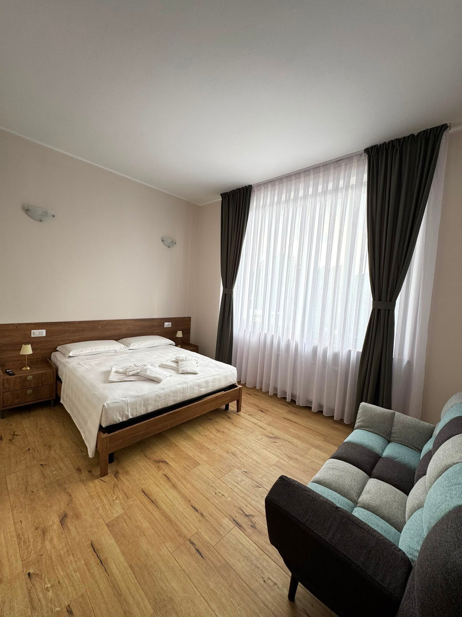 Camera Deluxe con letto matrimoniale e divano